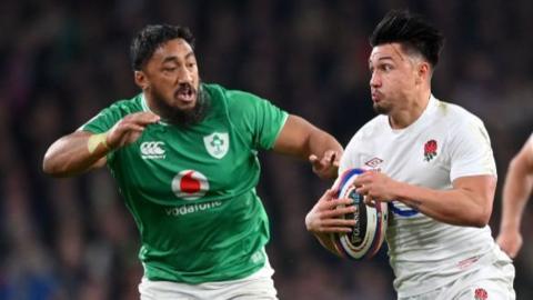 Bundee Aki of Ireland chases England's Marcus Smith during the 2024 Six Nations match at Twickenham