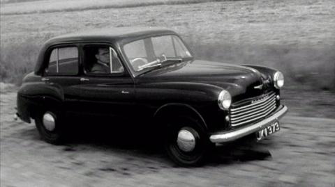 A black Hillman Minx car on the test track.