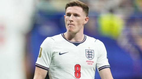 Elliot Anderson in action for England at the World Cup, wearing white kit with number 8 on front of shirt