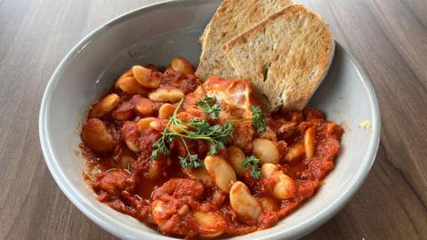 Harrisa baked beans with a side of sourdough toast.