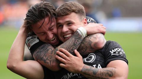 Brunt (r) of Boreham Wood scorer of the winning goal celebrates with team-mate Cameron Coxe