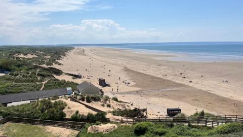 Saunton Sands seen from an elevated point at the north end of the beach with the view stretching to the opeing of the Taw Estuary