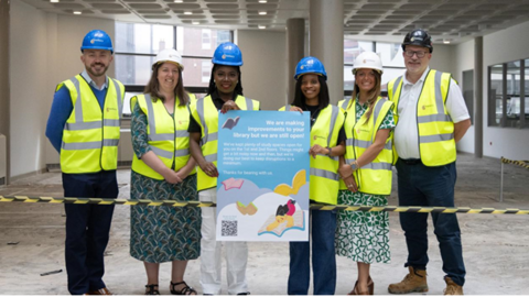 Adrian Jones, Senior Project Manager (Estates and Facilites at the University), Jo-Anne Watts, University Librarian, Yetunde Adedipe, VP Academic (Wolves Student’s Union), Oluwafunbi Babatunde, VP Community and Welfare (Wolves Student’s Union), Dr Clare Dickens, Associate Director – Student Life (University) and Peter Kempster, Project Manager (Overbury) inside the library under construction