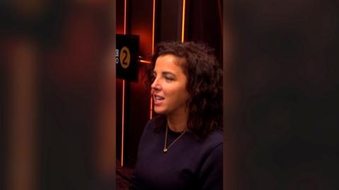Jamie-Lee O'Donnell wearing a black top in a BBC radio studio.