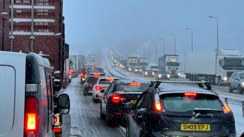 Image shows traffic at a standstill on the M62 motorway near Kirklees, West Yorkshire, due to heavy snow in the area. Picture date: Friday March 10, 2023