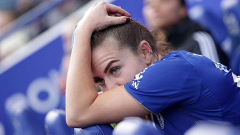 Shannon O'Brien holds her head
