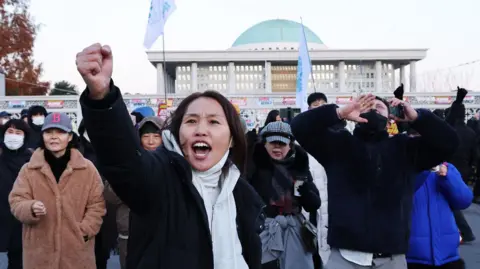 Protesters call for the resignation and impeachment of South Korean President Yoon Suk Yeol outside the National Assembly in Seoul,