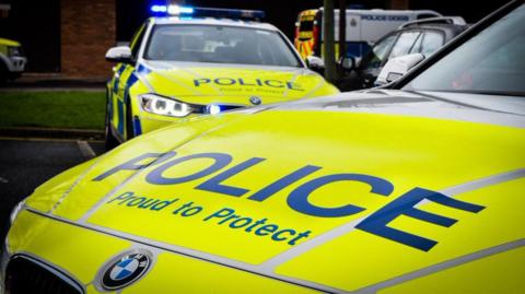 Stock image of two Northumbria Police cars bearing the slogan Proud to Protect.