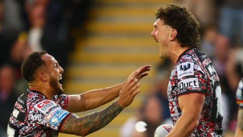 Robbie Mulhern (right) celebrating with team-mate Liam Horne after scoring a try for Leigh Leopards