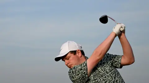 A close-up of Bob MacIntyre teeing off