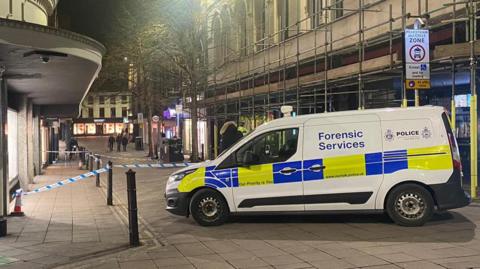 A police forensic services van is parked outside Jarrolds department store in Norwich city centre. 