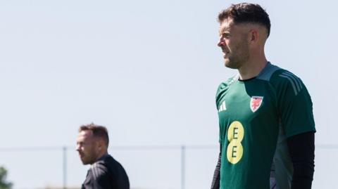 Connor Roberts (right) during Wales training in Spain with manager Craig Bellamy in the background