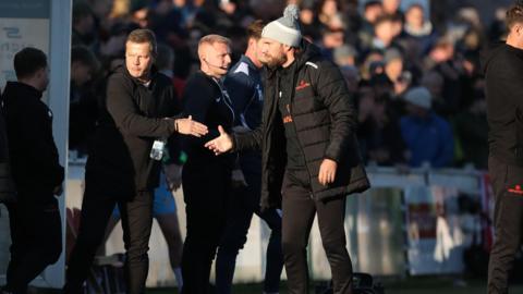 Michael Murray shaking hands with Yeovil Town manager Mark Cooper