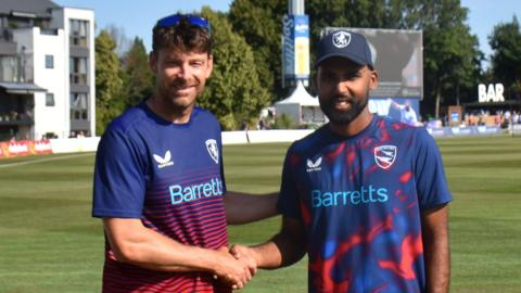 Kent director of cricket Simon Cook shakes hands with the county's new all-rounder Mohammed Rizvi