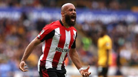 Bryan Mbeumo celebrates in Brentford kit