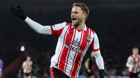 Leo Scienza celebrates after Saints beat the Blades