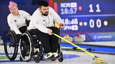 Jason Kean and Joanna Butterfield of Team Great Britain compete during the Wheelchair Curling Mixed Doubles at the Paralympics. 