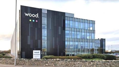 The Wood Group offices in Aberdeen - a four storey office building with floor-to-ceiling windows. 
