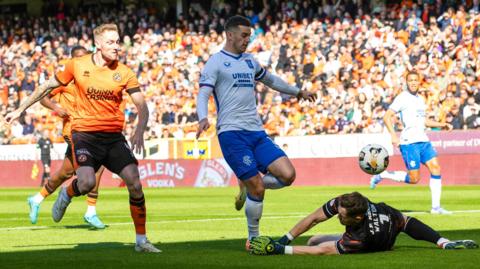 Tom Lawrence of Rangers scores at Dundee United