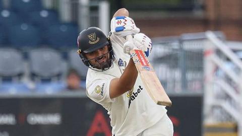 Danial Ibrahim hitting a shot with a high left elbow for Sussex v Durham