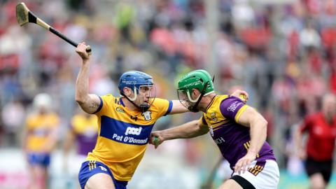 Clare's Shane O'Donnell attempts to get past Wexford's Matthew O'Hanlon at Semple Stadium