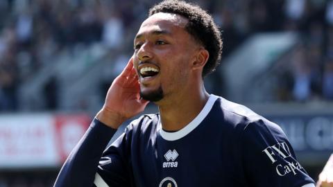 Femi Azeez celebrates scoring for Millwall