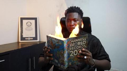 magician with fire in his book