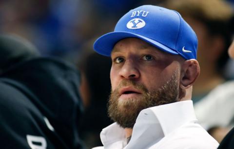 Conor McGregor in a blue basball hat