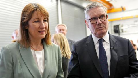 Rachel Reeves and Keir Starmer standing next to each other, wearing serious expressions