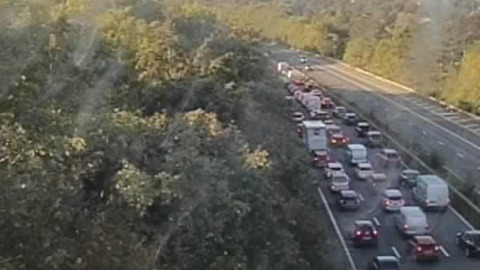 A grainy traffic camera image of a queuing traffic on the A1