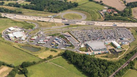An aerial view of a large motorway service.