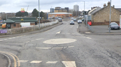 a screenshot from google maps of a roundabout in a built up area.