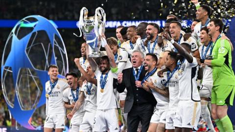 Real Madrid celebrate with the 2023-24 Champions League trophy