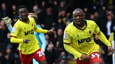 Edo Kayembe celebrates scoring Watford's second goal against Luton