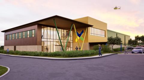 Artist impression of The Air Ambulance Service's new base - a purpose-built building in Catthorpe, Leicestershire - which shows an air ambulance helicopter flying overhead.