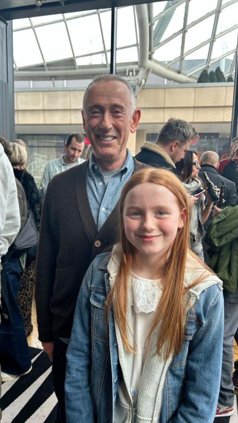 Anna Cook standing with another actor 