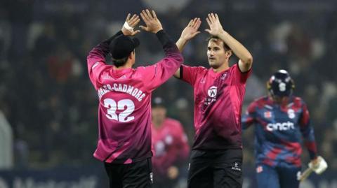 Somerset captain Lewis Gregory high-fives team-mate Tom Kohler-Cadmore