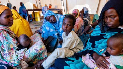 A young Sudanese refugee wait to be examined by a Doctors Without Borders (MSF) medical team at the MSF mobile hospital at the Touloum refugee camp in the Wadi Fira province, Chad, on April 8, 2025