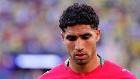 Achraf Hakimi warms up for Morocco