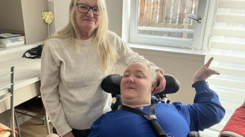 Sandra and Margaret McMurdo are the two woman together (one in a wheelchair