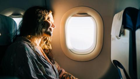 Woman relaxing on a flight 