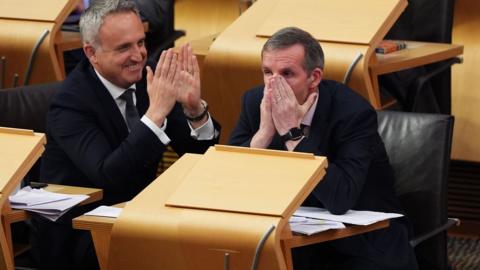 MSP Liam McArthur has his head in his hands as he finds out his bill on assisted dying has passed stage one