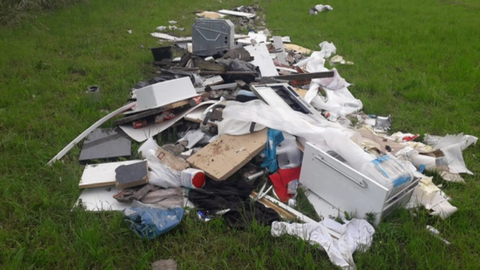Rubbish strewn over a large area on a farm field