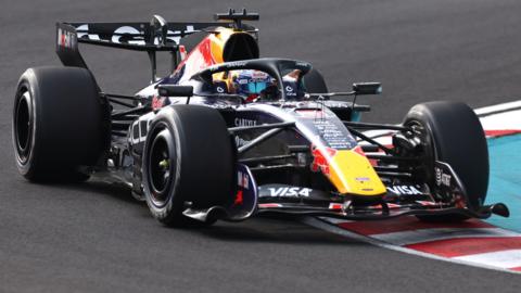 Red Bull's Max Verstappen drives across a kerb during the 2026 Japanese Grand Prix