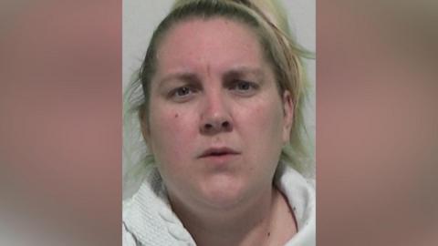 Mugshot of Joanne Nicholson. She has blond hair pulled back into a ponytail and looks surprised.