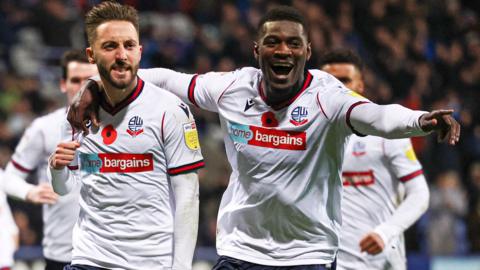 Bolton celebrate scoring against Crewe