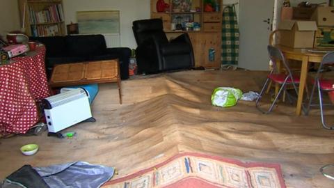 The floor in Helen Jones' house has been lifted by the flood