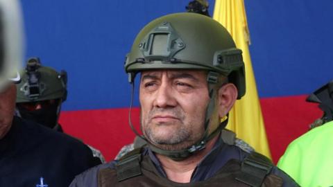 Colombian drug trafficker Dairo Antonio Usuga David, also known as "Otoniel", is pictured as he gets escorted by police officers after Colombia extradites him to the United States, in Bogota, Colombia May 4, 2022.