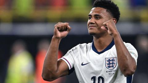 Ollie Watkins celebrating England's win over the Netherland with arms aloft