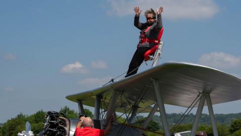 Esther Hussey on top of the plane before take off